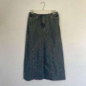 Mid wash buttonless maxi denim skirt.